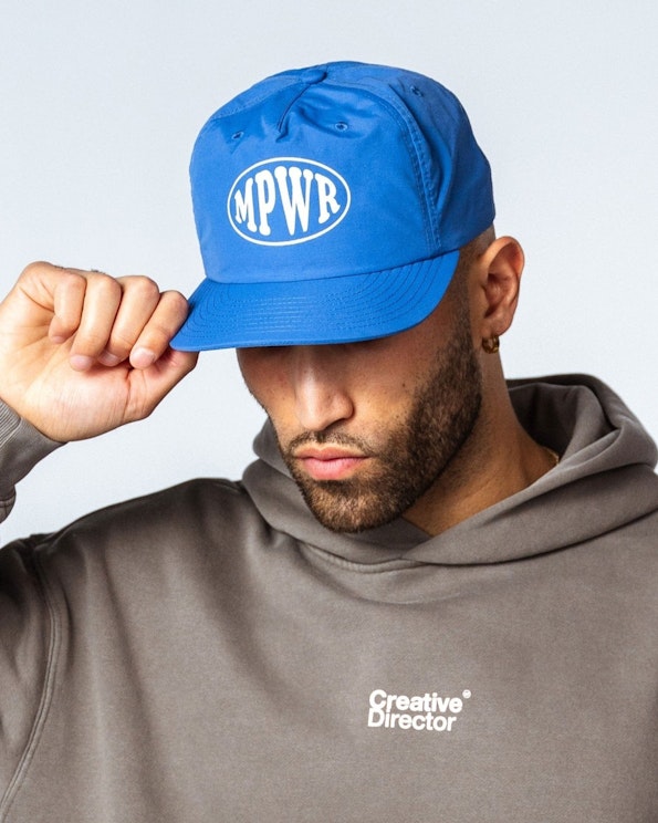 Screen printed blue nylon surf cap with white oval MPWR logo graphic, produced by MerchCamp for MPower6 Gym