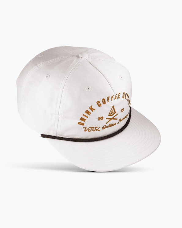 Embroidered white nylon rope cap with gold coffee-themed graphic and dark cord detail, produced by MerchCamp for VSSL Gear