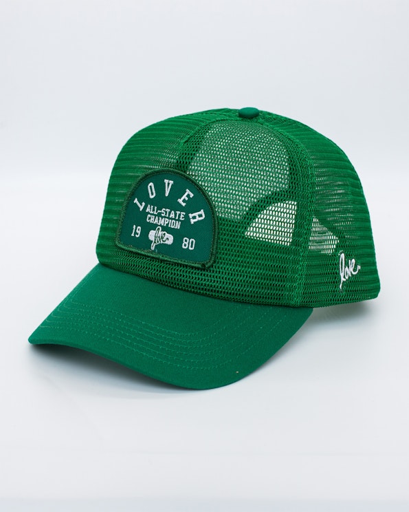 Full custom green mesh snapback with embroidered arch patch and cursive love detail, produced by MerchCamp for Ruben Rojas