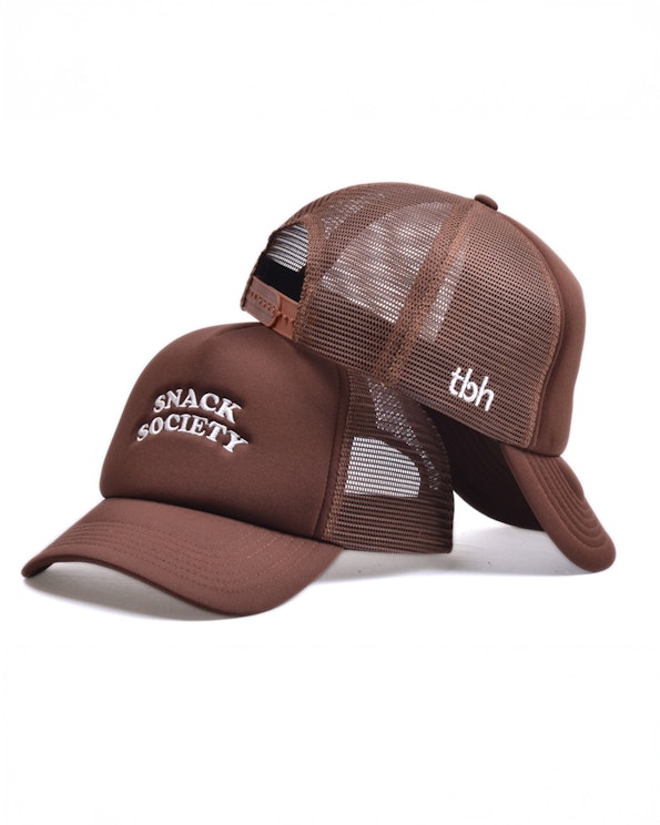 Embroidered brown mesh-back trucker hat with arched white lettering and side logo, produced by MerchCamp for Snack TBH