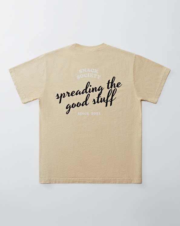 Screen printed sand cotton tee with italic script slogan and tonal arch logo, produced by MerchCamp for Snack TBH