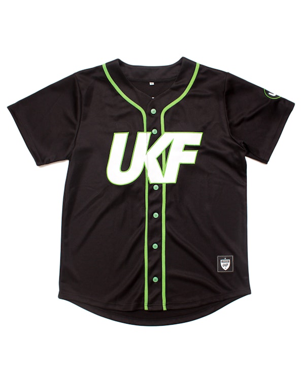 Full custom black baseball jersey with green piping trim and white UKF logo, produced by MerchCamp for UKF