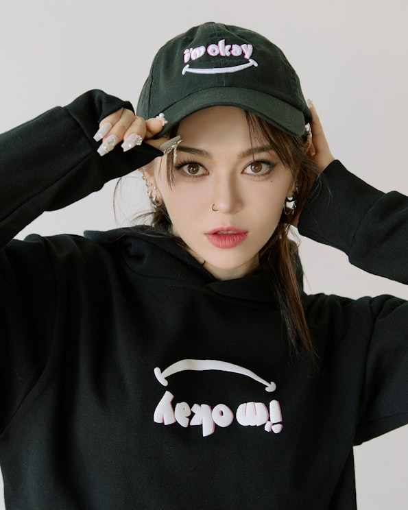 Puff printed black pullover hoodie with upside-down "i'm okay" smiley face graphic, produced by MerchCamp for Mindset