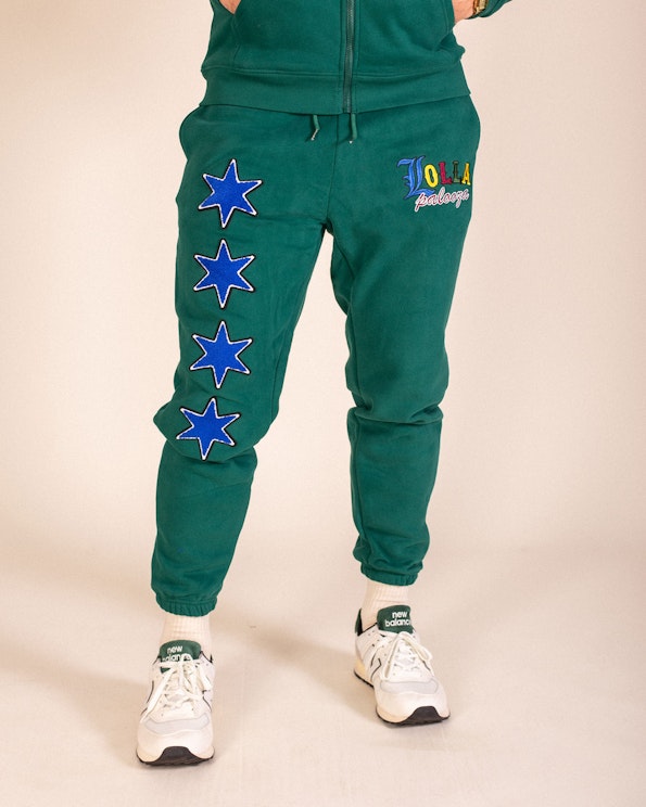Custom green fleece joggers with blue chenille star patches and embroidered colorful logo, produced by MerchCamp for Lollapalooza
