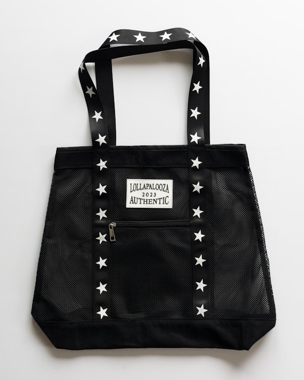 Full custom black mesh tote bag with white star-print straps and woven label patch, produced by MerchCamp for Lollapalooza