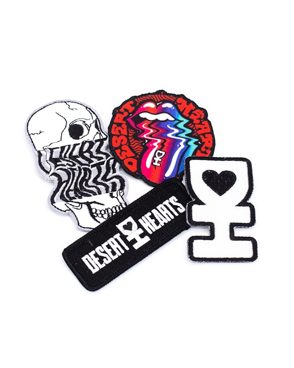 Embroidered custom patch set with skull, psychedelic tongue, and heart logo designs, produced by MerchCamp for Desert Hearts