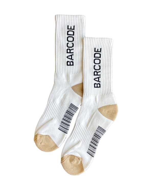 Full custom white ribbed crew socks with knit barcode graphic and tan heel and toe, produced by MerchCamp for Barcode