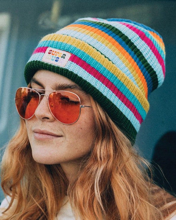 Full custom multicolor striped knit beanie with woven brand label patch, produced by MerchCamp for Multiverse