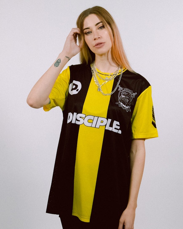 Full custom black and yellow striped mesh soccer jersey with bulldog crest, produced by MerchCamp for Disciple Records
