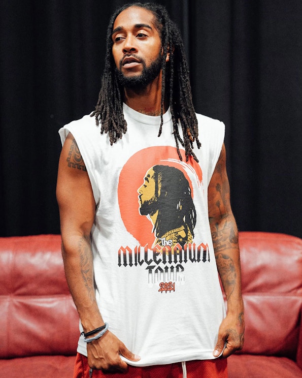 Screen printed white cotton muscle shirt with red and gold profile portrait graphic, produced by MerchCamp for Omarion Worldwide