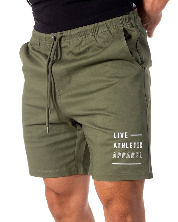 Screen printed olive green cotton drawstring shorts with white typographic branding, produced by MerchCamp for Live Athletic