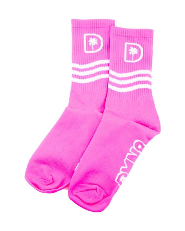 Full custom pink poly knit crew socks with white palm tree logo and stripe detail, produced by MerchCamp for DMN8