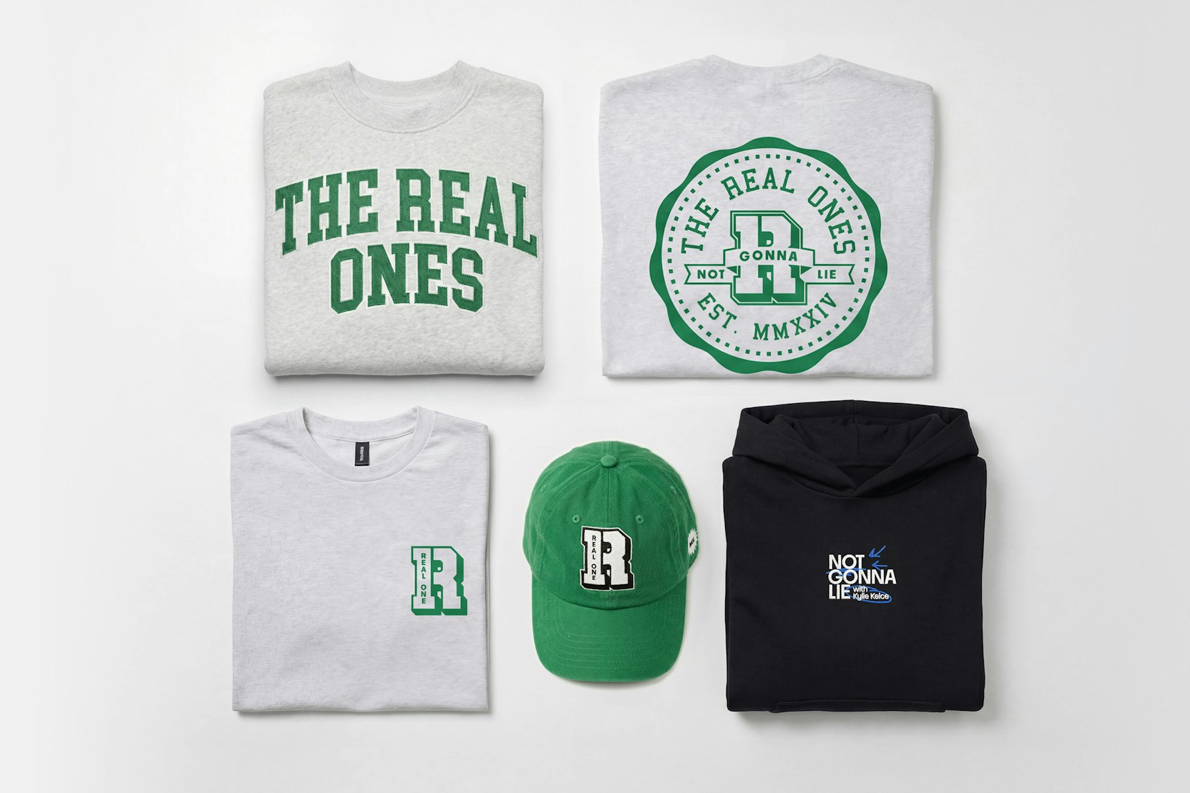 Flat lay of branded merch collection featuring grey sweatshirts, green cap, — WAVE Sports + Entertainment merchandise by MerchCamp