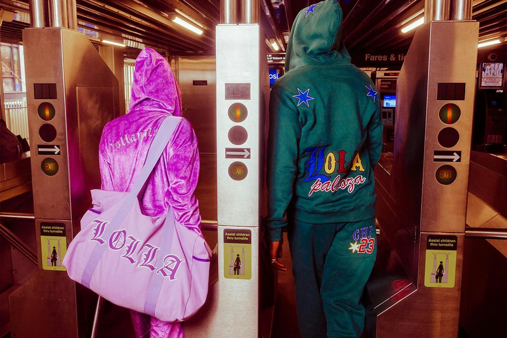 Two people in Lollapalooza hoodies and sweatsuits walking through Chicago subway turnstiles — Lollapalooza merchandise by MerchCamp