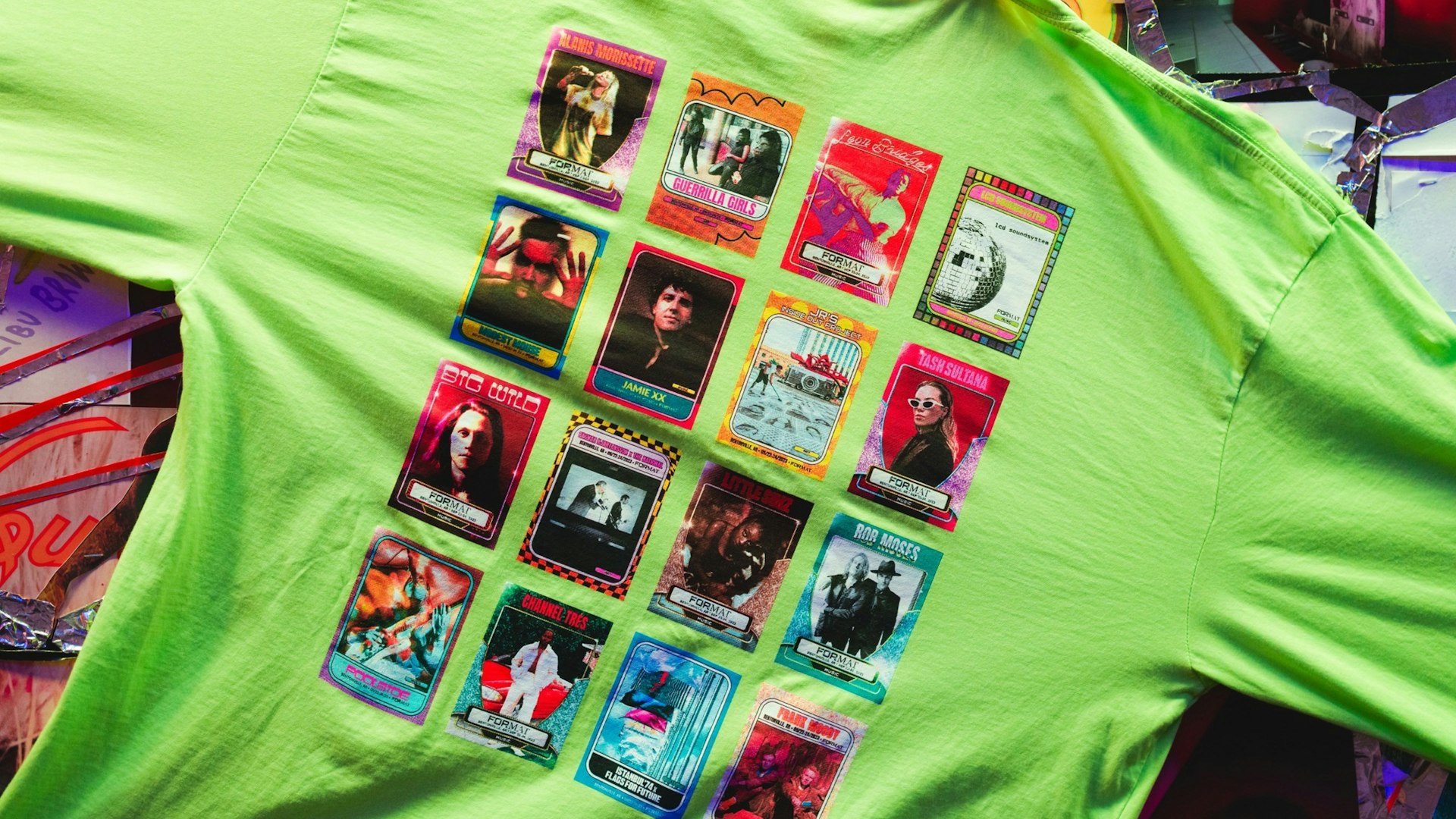 Neon green t-shirt featuring colorful trading card-style artist graphics for Format music — Live Nation merchandise by MerchCamp
