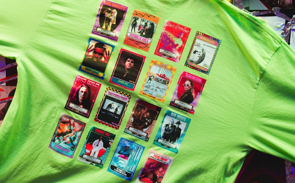 Neon green graphic tee with colorful trading card-style concert artist prints, produced by MerchCamp for Live Nation