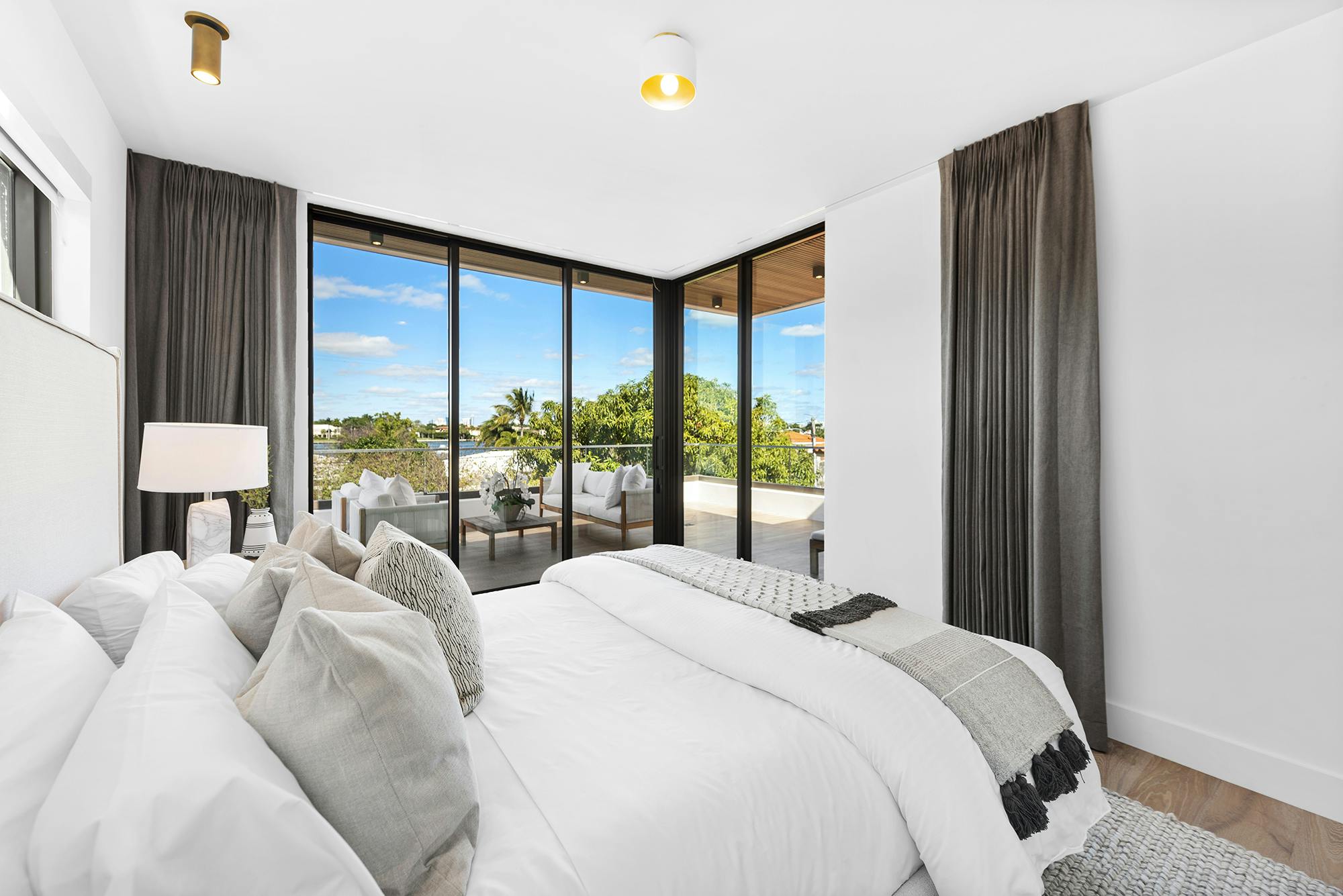 Meridith-Baer-Home-Home-Staging-Florida-Stillwater-Serenity-Luxury-Homes-Modern-and-Contemporary-Second-Bedroom-Balcony-Access