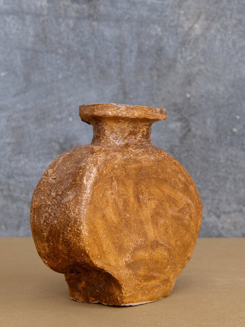Colour image displaying the Flat Vase I in brown by Willem van Hooff. The ceramic vase is part of the new 2024 spring collection 'Observations' by online gallery Metamorphoses Objects.