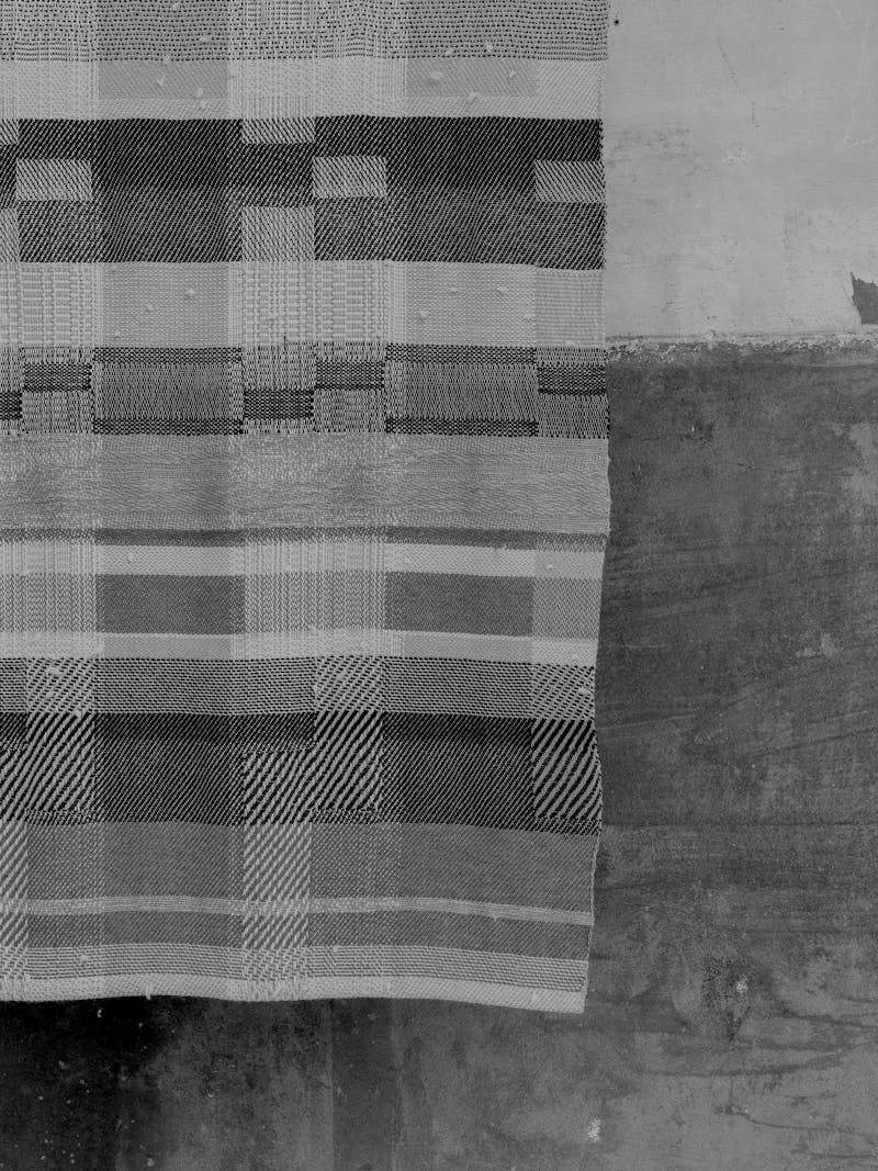 Black and white image displaying details of Handwoven Wall Piece by Catarina Riccabona. This textile item is made using block design technique and belongs to the new 2024 spring collection 'Observations' by online gallery Metamorphoses Objects.
