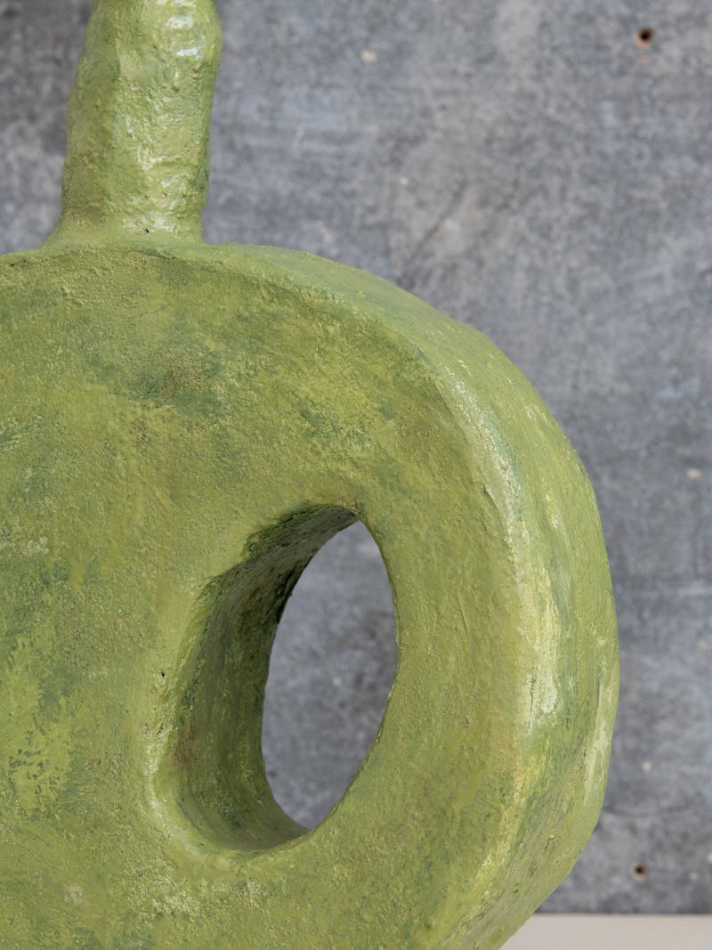 Colour image displaying close-up detail of the Flat Vase IV in green by Willem van Hooff. This ceramic vase is exclusively made for the new 2024 spring collection 'Observations' by online gallery Metamorphoses Objects.