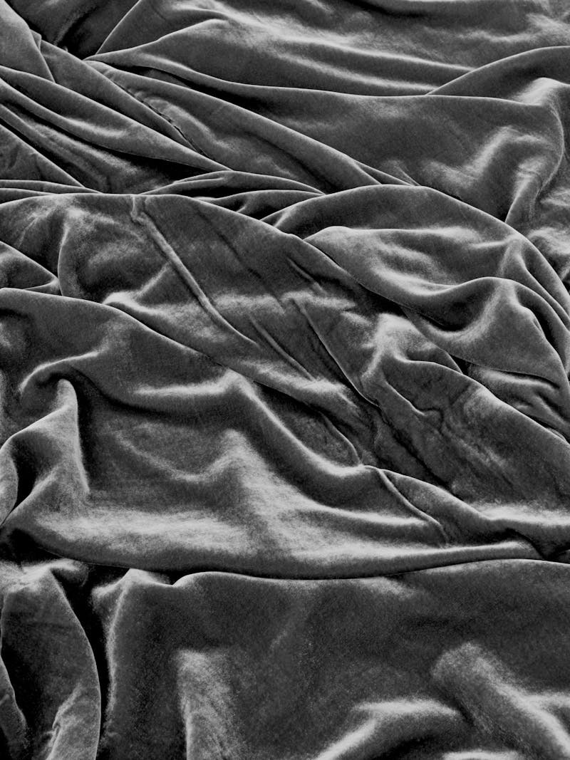 Black and white image displaying texture details of the Velvet Blankets in green by material studio Buro Belén. This item is part of the new 2024 spring collection 'Observations' by online galley Metamorphoses Objects.