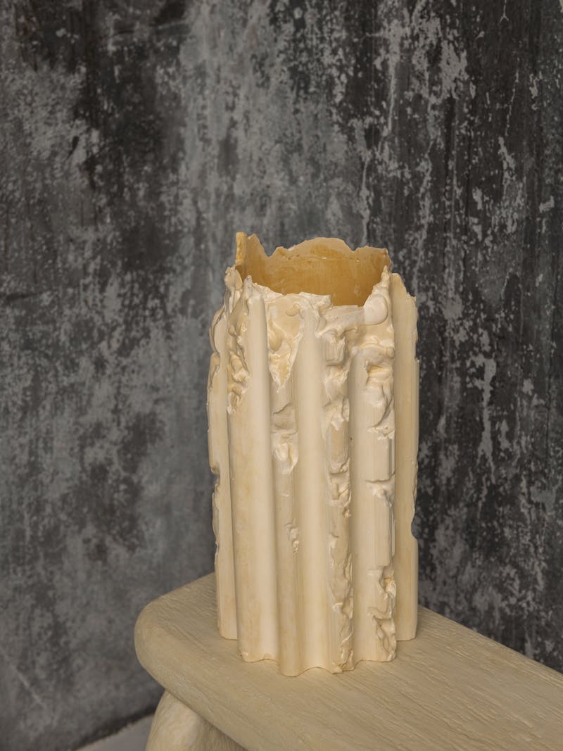 Colour image displaying Cornice Vessel in cream by Lenny Stöpp. The column vase is moulded from alpha crystalline gypsum using the cornice vessel technique. This item is part of the new 2024 spring collection 'Observations' by online gallery Metamorphoses Objects.