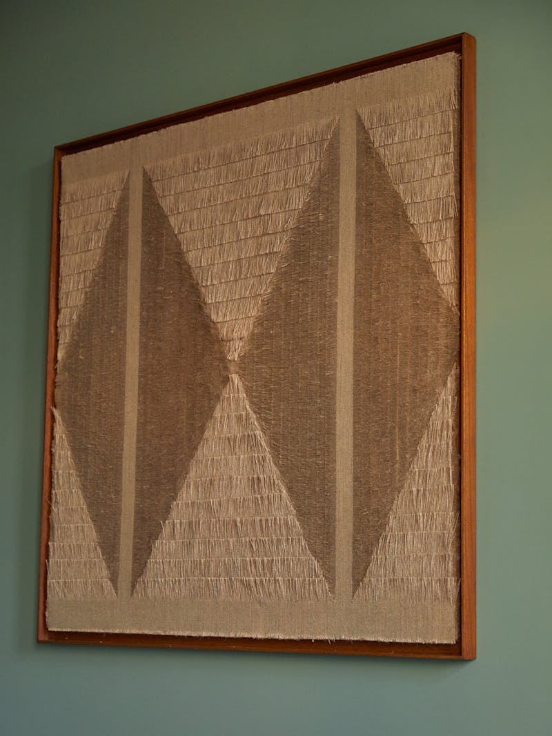 beige coloured textile wall piece by Sophie Rowley artist and designer based in Berlin who uses a unique fraying technique to create patterns in jute textiles. 