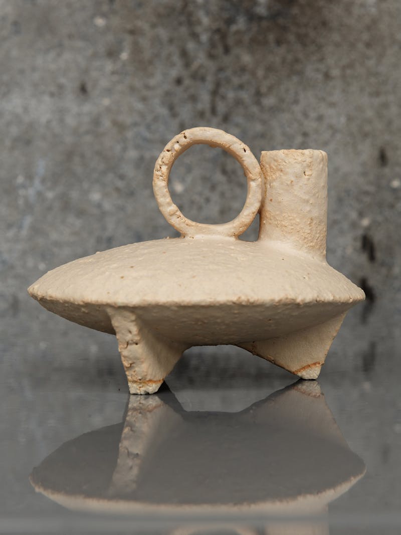 Colour image displaying Cocotte 11 in cream  by Catherine Dix, made from red stoneware clay. These unique, ceramic sculptures are part of the new 2024 spring collection 'Observations' by online gallery Metamorphoses Objects.