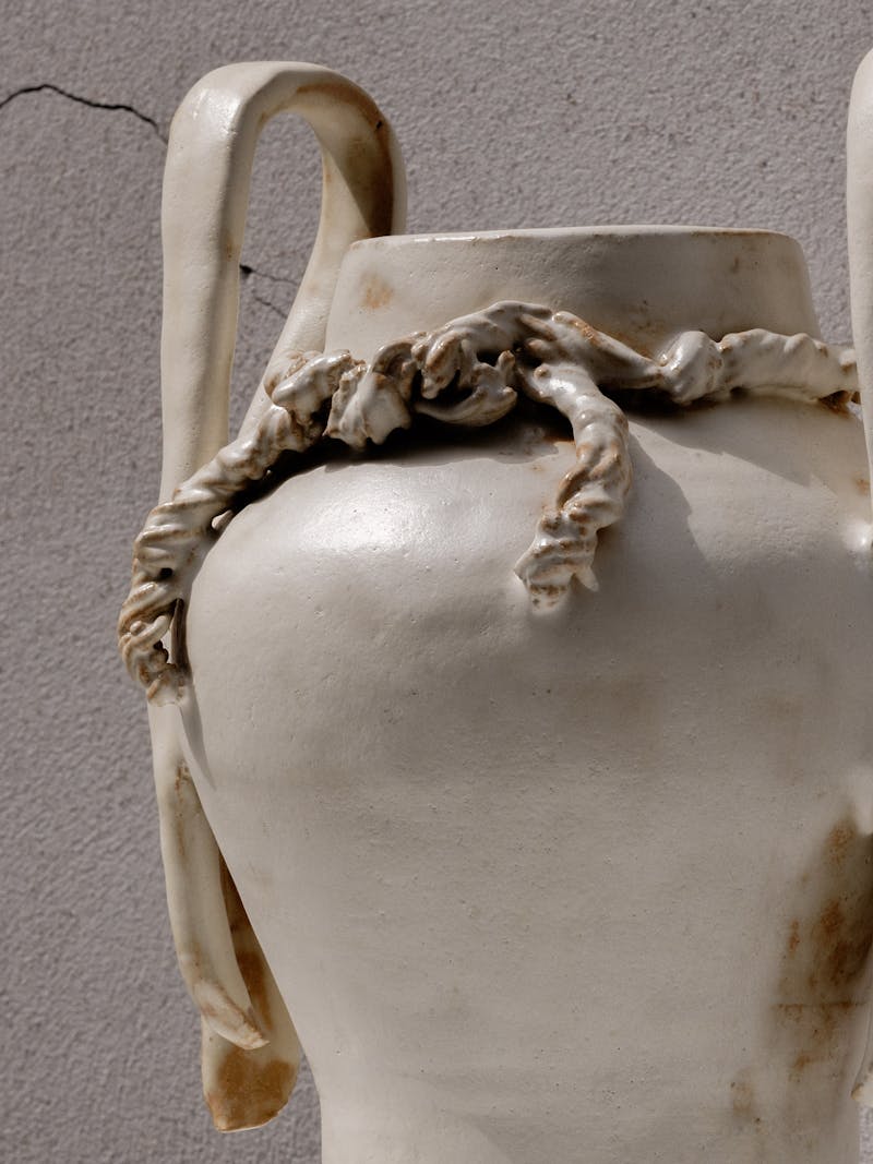  image displaying frontal detail of "Never Been to Japan" Vase III by Juliette Teste in 2024. The beige-coloured ceramic vase is handmade from glazed stoneware clay. This object is part of the new 2024 spring collection 'Observations' by online gallery Metamorphoses Objects. 