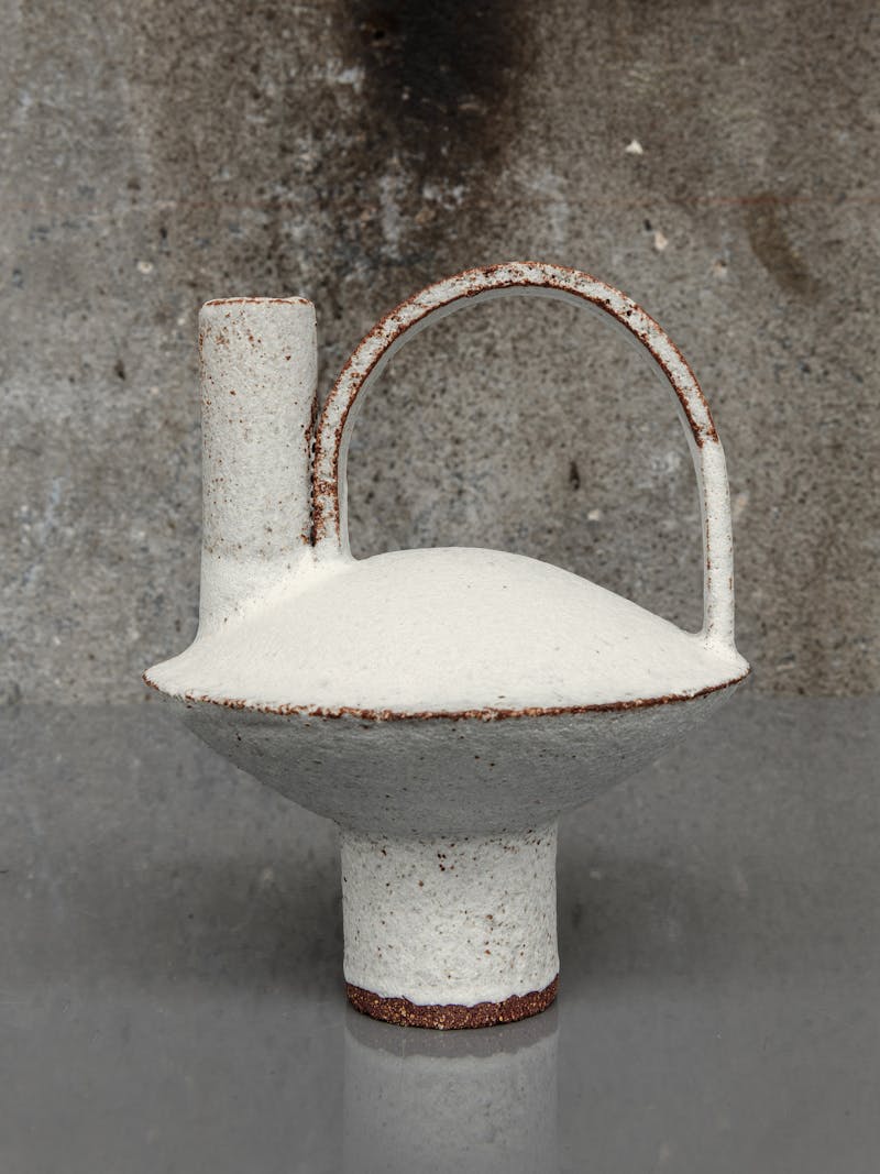 Colour image displaying Cocotte 09 in white by Catherine Dix, made from red stoneware clay. This unique, ceramic sculpture is part of the new 2024 spring collection 'Observations' by online gallery Metamorphoses Objects.