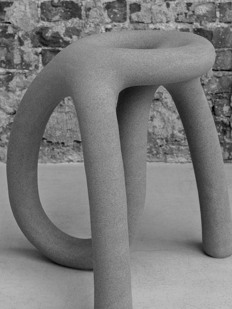 Black and white image displaying close-up details of the exclusive bespoke stool by Fabio Hendry from Hot Wire Extensions. This unique, design chair is part of the new 2024 spring collection 'Observations' by online gallery Metamorphoses Objects. 