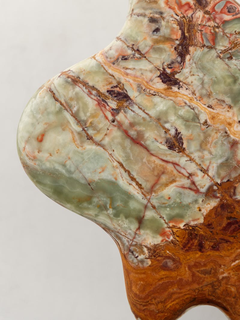 Colour image displaying details of the Ondamarmo Side Table in light green onyx by Bloc Studios. This beautiful marble side table is part of the new 2024 spring collection 'Observations' by online gallery Metamorphoses Objects.