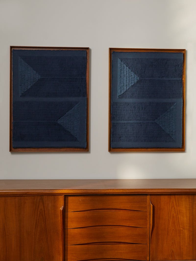 dark blue frayed textile diptych in a wooden frame by New Zealand born and Berlin based fibre artist and designer Sophie Rowley. 