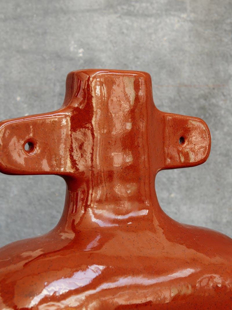Colour image displaying detail of terracotta vase by Jade Paton. This one-of-a-kind object belongs to the new 2024 spring collection 'Observations' by online gallery Metamorphoses Objects.