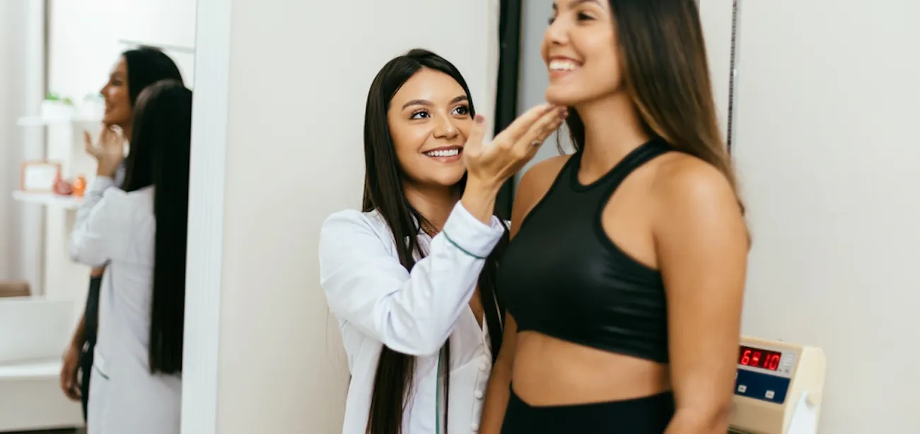 a lady checking her weight using a height weight chart