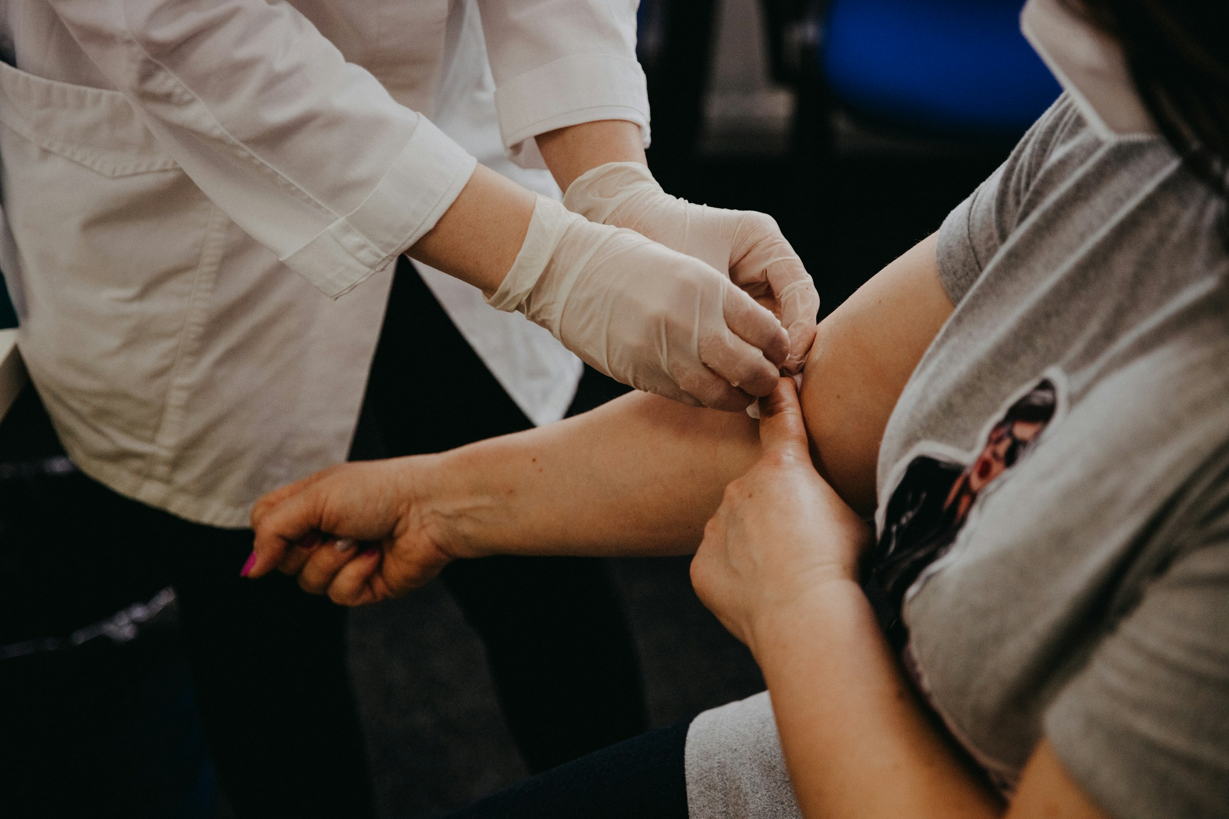 A patient receiving a comprehensive metabolic panel tests