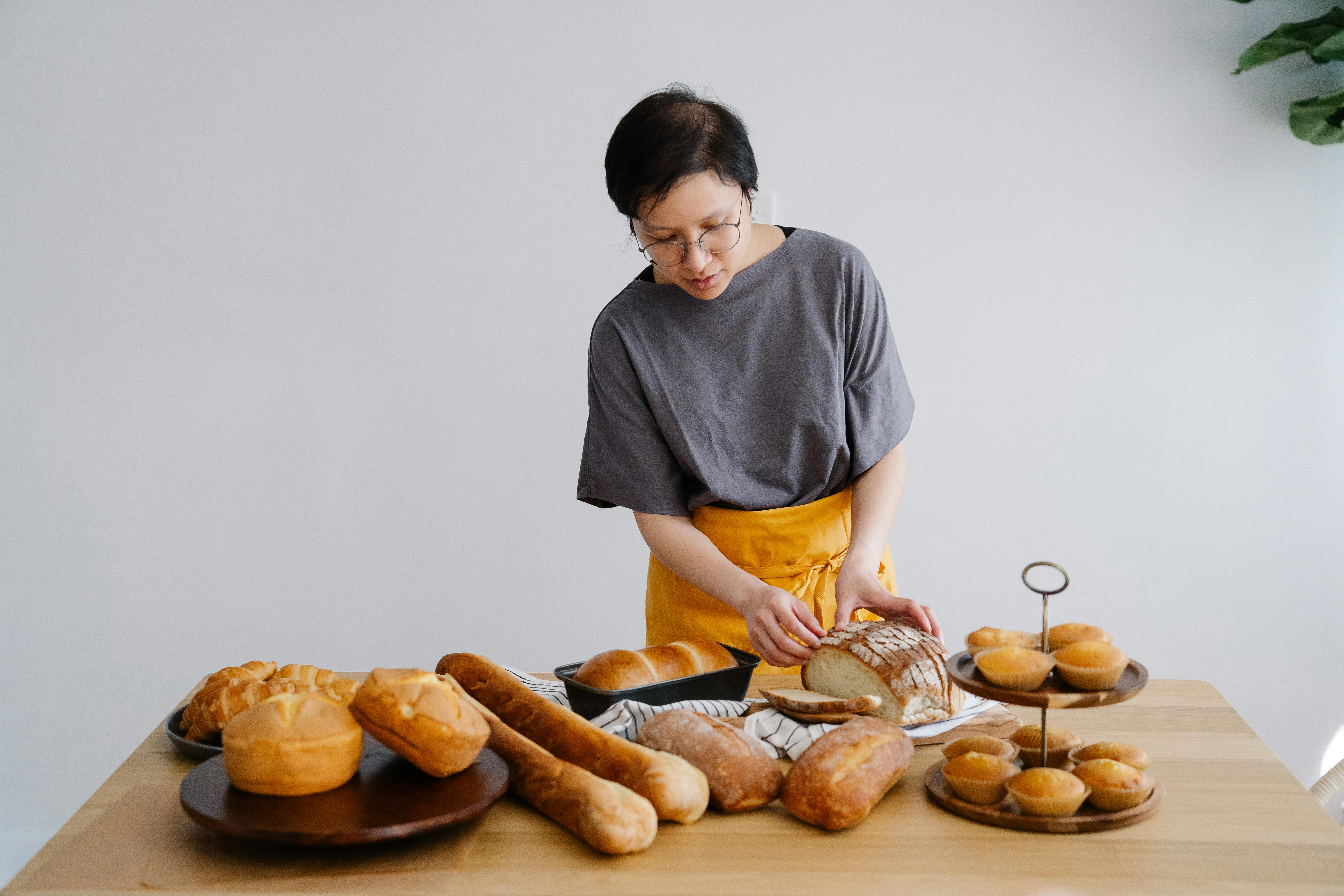 A baker with Sourdough bread and other low-GI bread