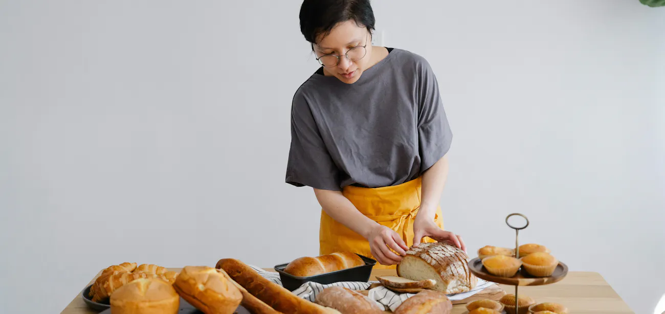 A baker with Sourdough bread and other low-GI bread