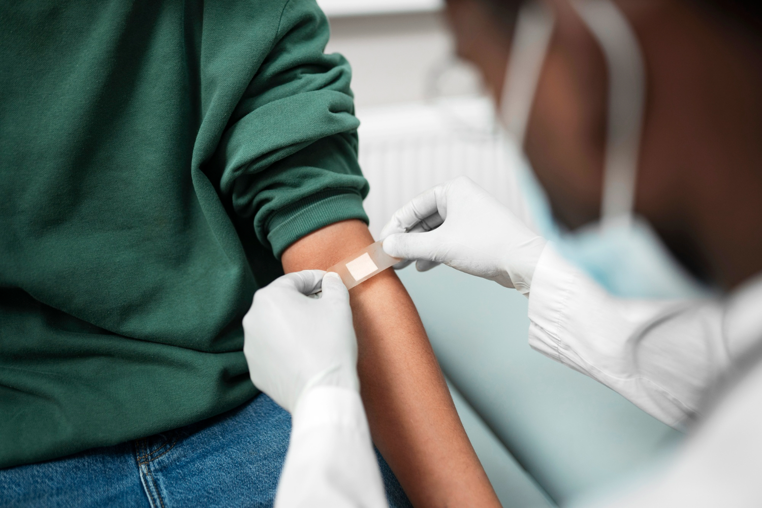Person with diabetes donating blood safely