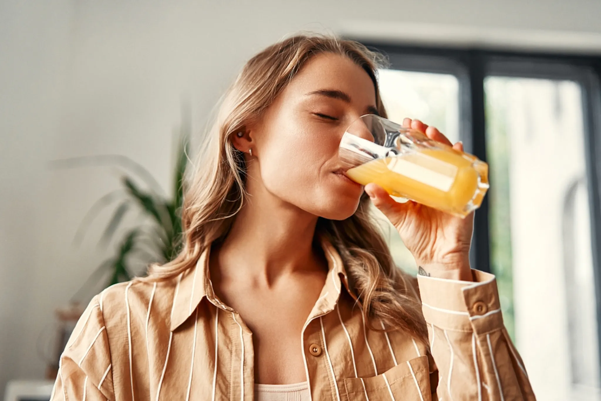 A lady taking a high fructose drink