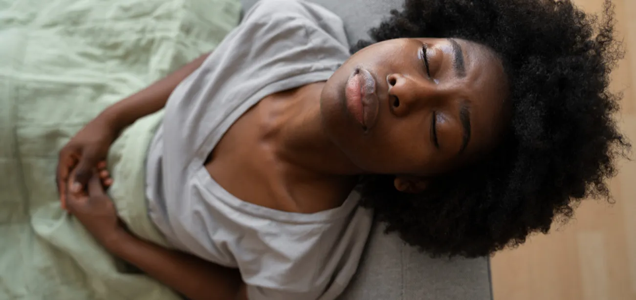 Lady feeling bloated due to fructose malabsorption