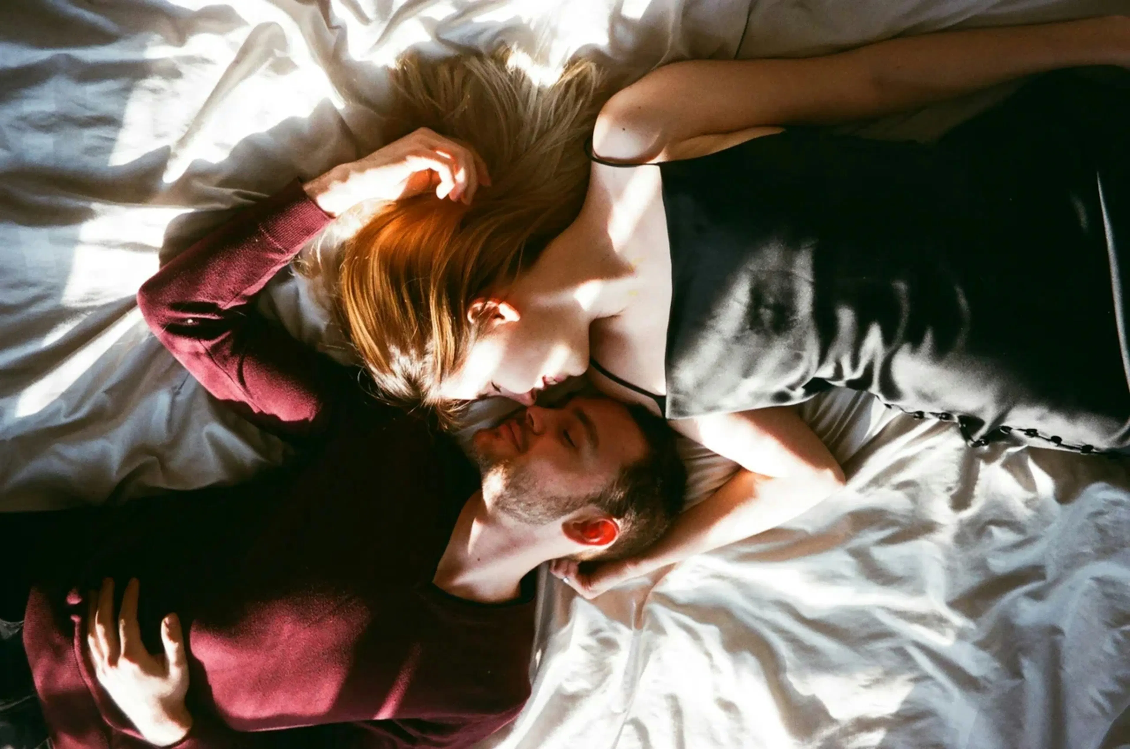Couple sharing a romantic moment in bed
