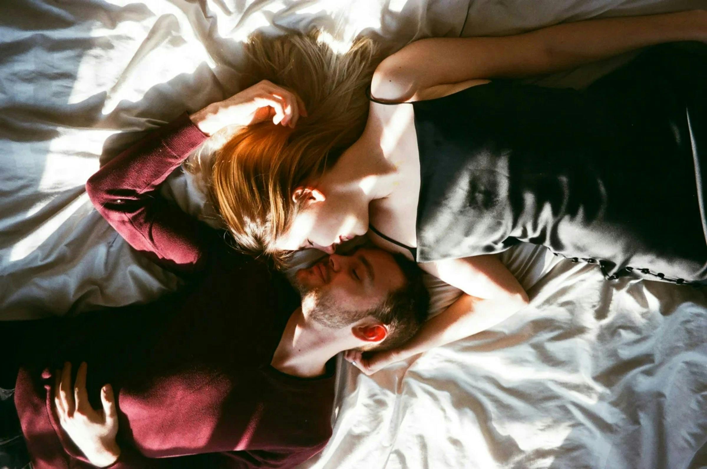 Couple sharing a romantic moment in bed