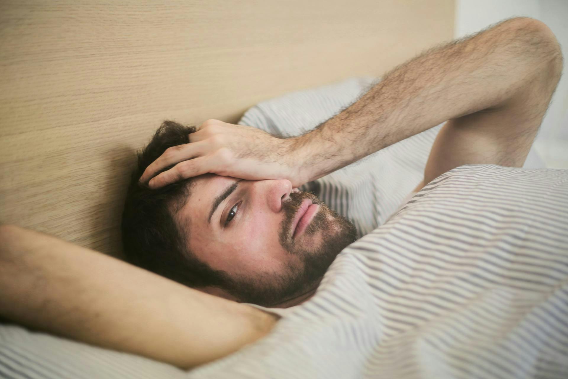 A man having difficulty sleeping