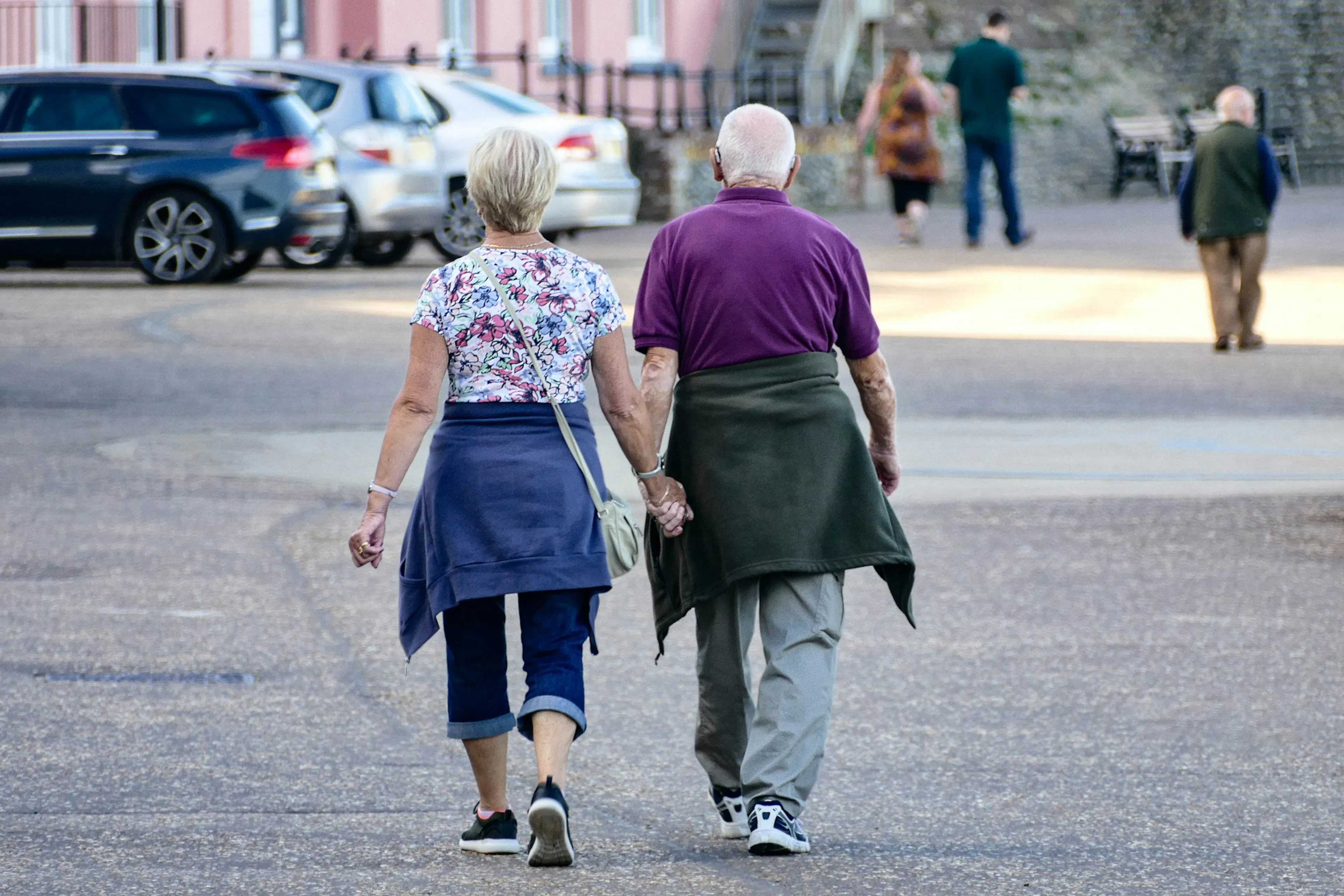 An elderly couple taking a walk