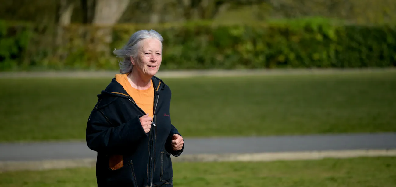 An elderly woman enjoying a run