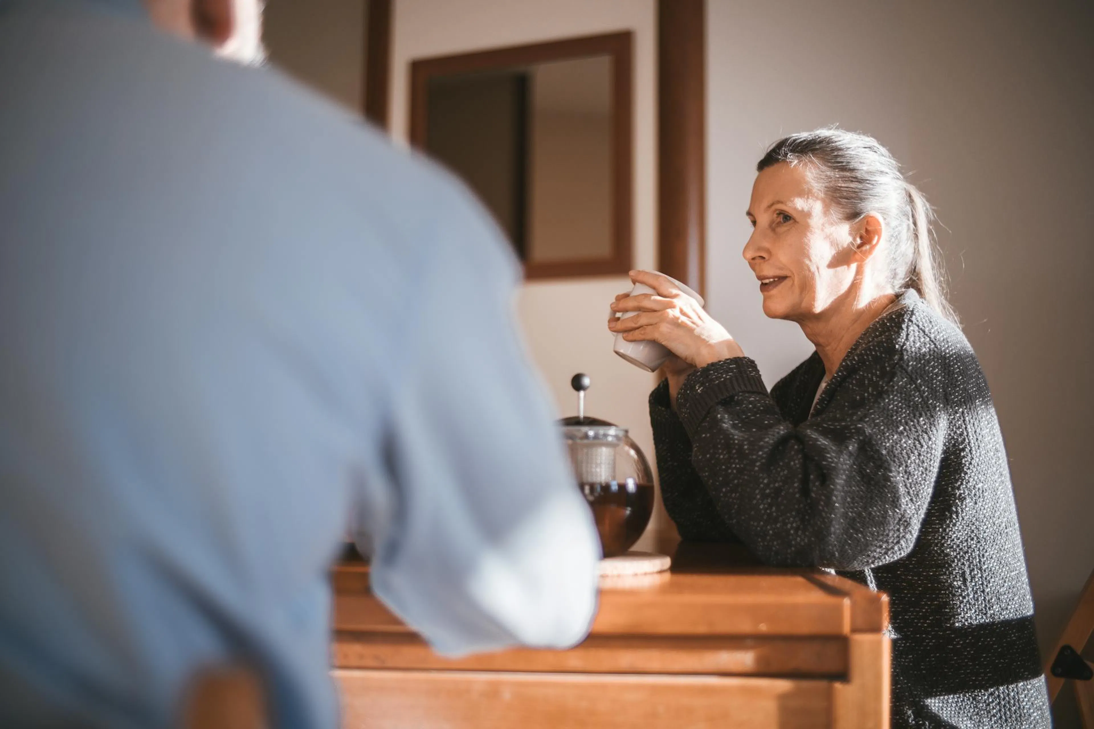 A lady taking a NAD+ precursor supplement