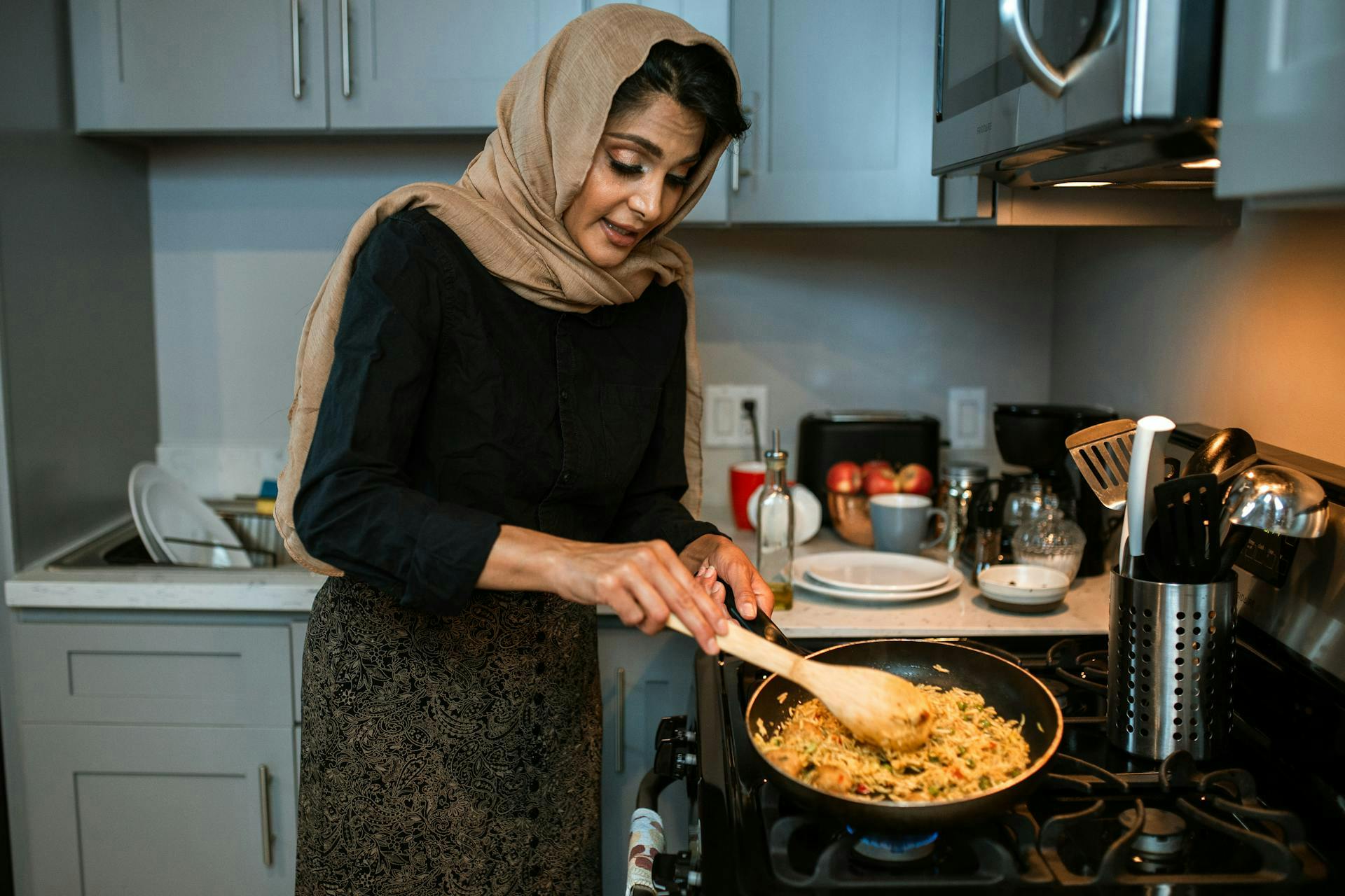 A lady cooking rice