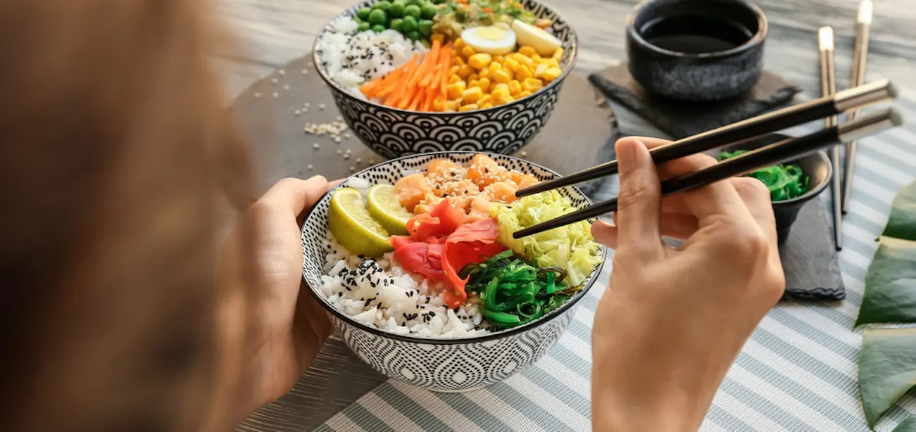 A bowl of cooked brown rice with vegetables