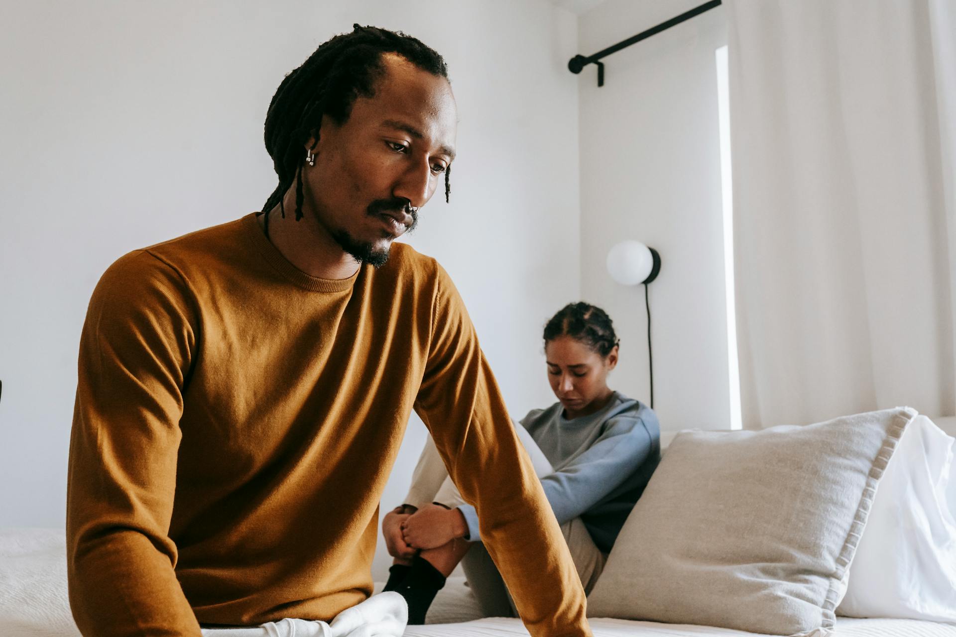 Man in bedroom wondering if testosterone boosters help ED
